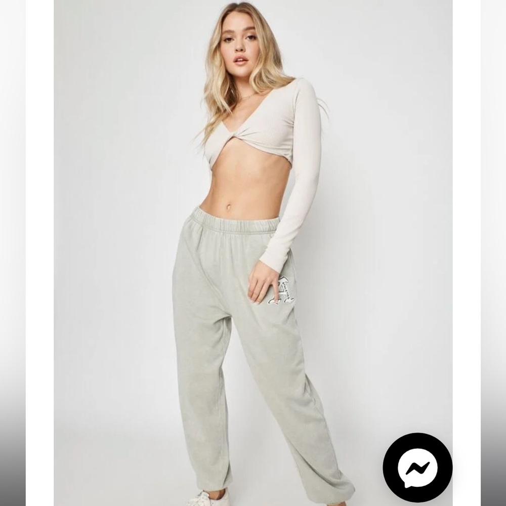 Mint green garage sweatpants, fairly worn with little hole on the bottom of leg.